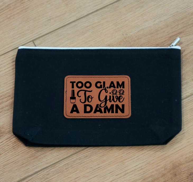 Personalized canvas cosmetic bag with leatherette patch, perfect for travel or everyday use.