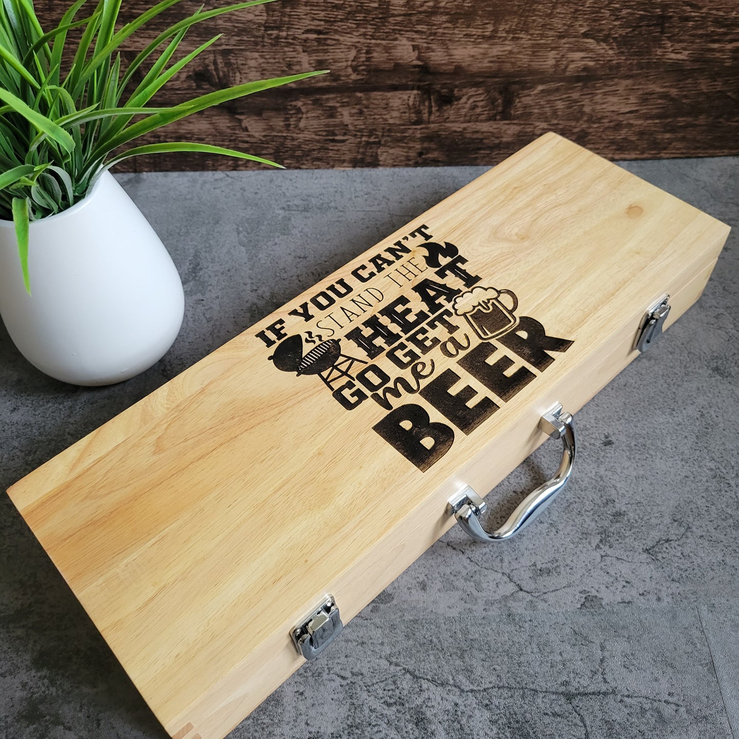 Premium personalized BBQ grill tool set with stainless steel spatula, tongs, fork, and basting brush in a carrying case – ideal for outdoor grilling, Father’s Day gifts, and custom laser engraving.