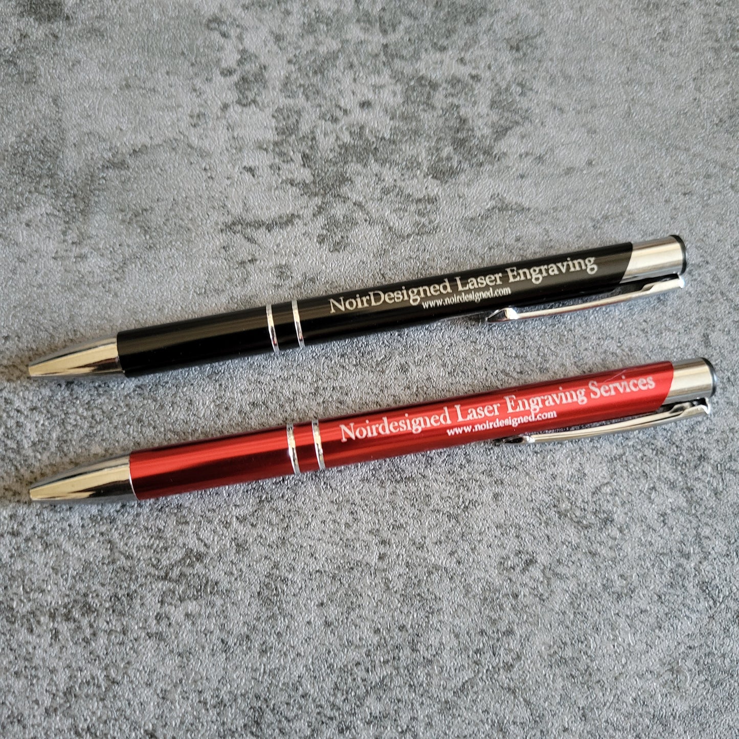 Engraved metal pen with custom text, perfect for branding and gifting