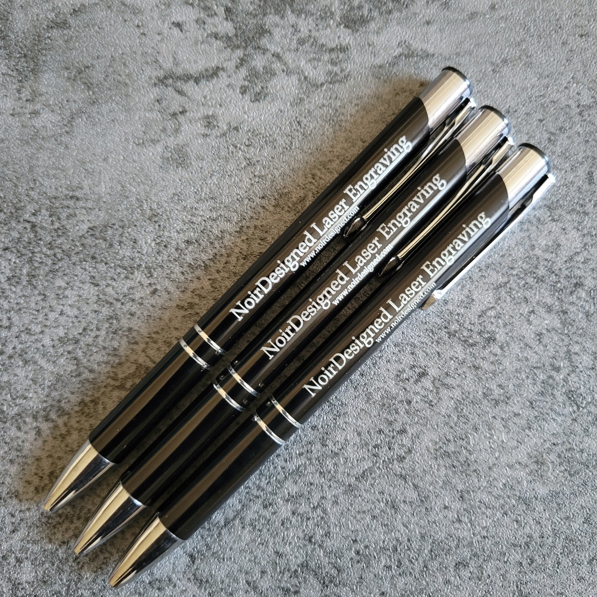 Engraved metal pen with custom text, perfect for branding and gifting