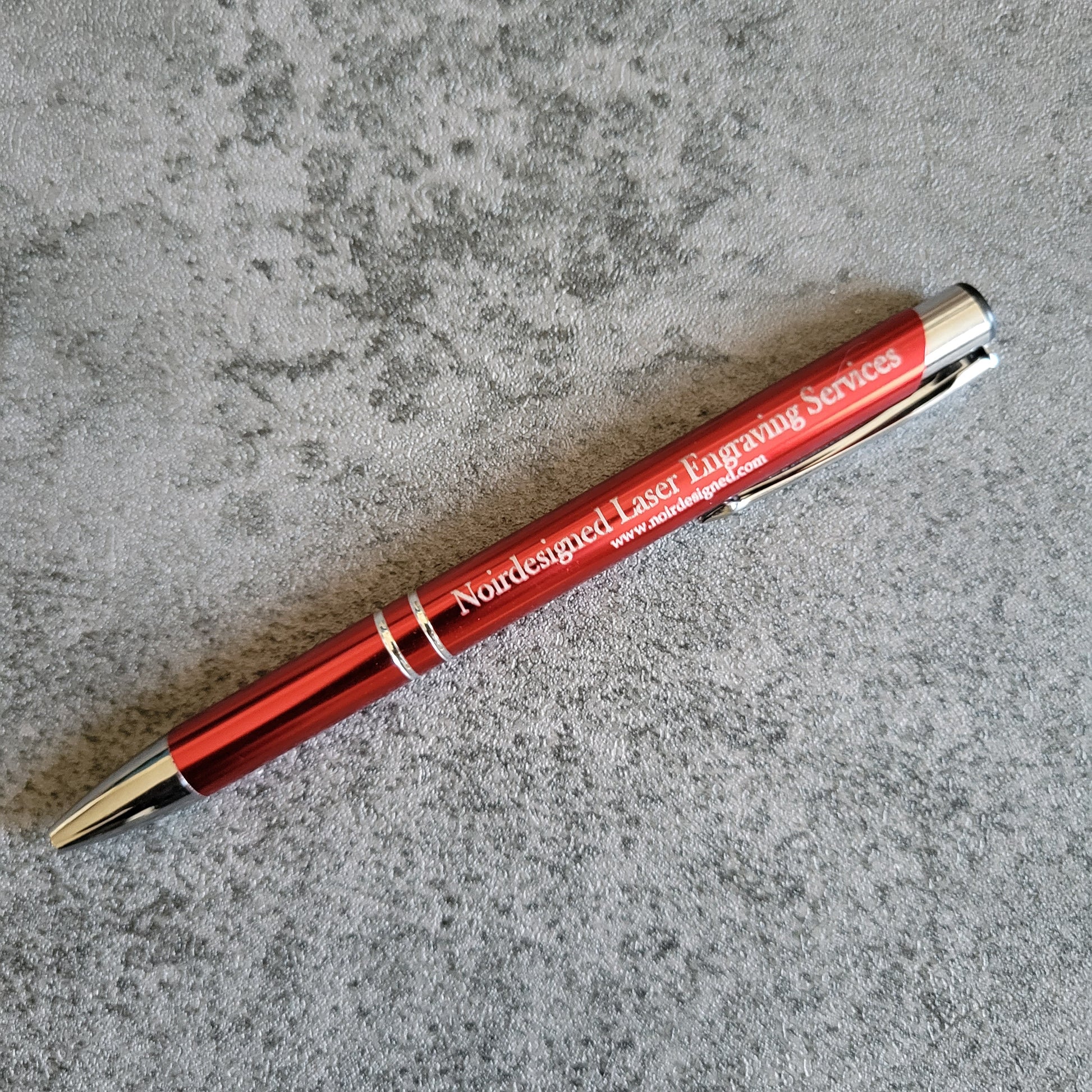 Engraved metal pen with custom text, perfect for branding and gifting
